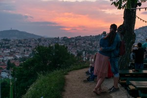 A couple watching the sunset in Sarajevo from the Yellow Fortress