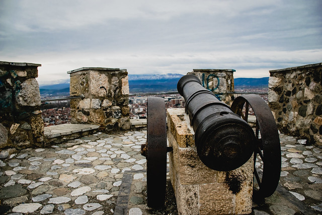 On top of the Prizren's fortress with cannons and a dramatic stormy winter sky